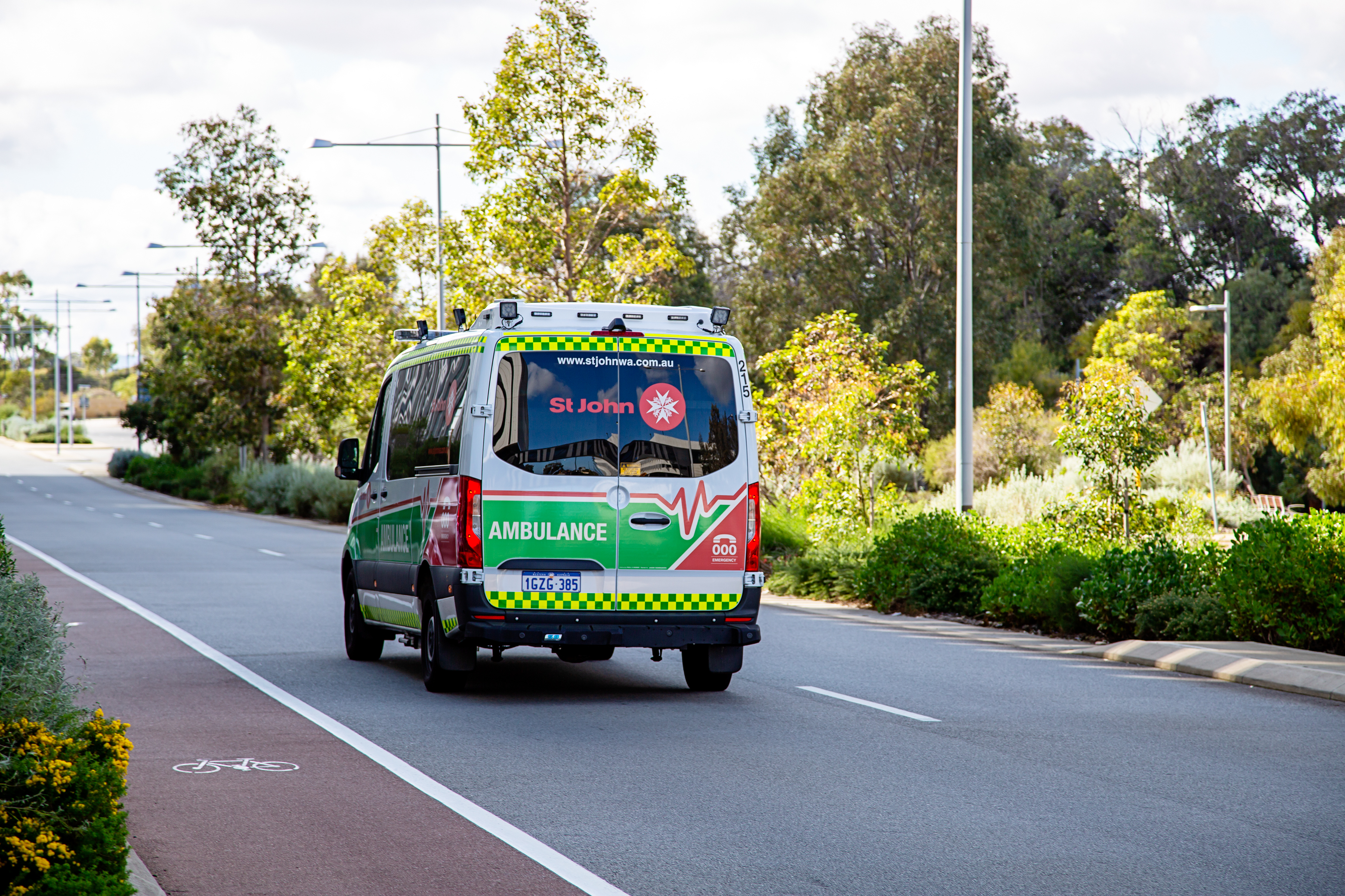 Ambulance travelling down a road