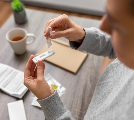 Person taking rapid antigen test