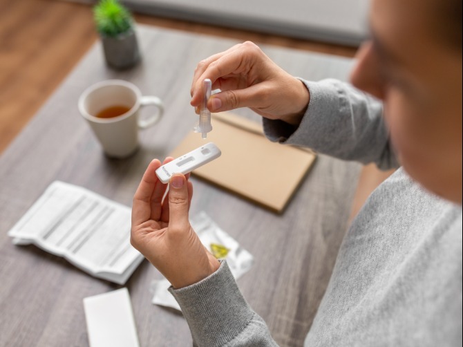 Person taking a rapid antigen test