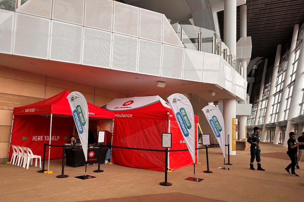 Red St John Ambulance pop up immunisation tents at Optus Stadium.