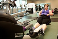 Woman using a rowing machine at the gym