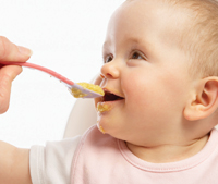 Young child being spoon fed