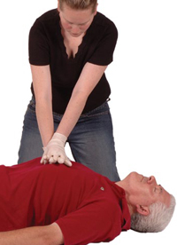 Woman performing chest compressions on a man’s chest.