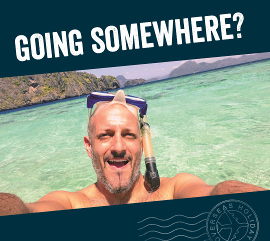 man taking a selfie while snorkelling at an exotic beach, titled with 'Going somewhere'