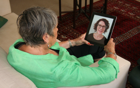 Woman having a telehealth appointment with an iPad