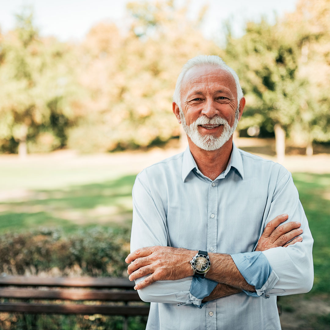 Older man standing in the park