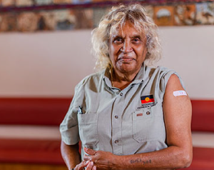 Aboriginal woman with a bandaid on her upper arm