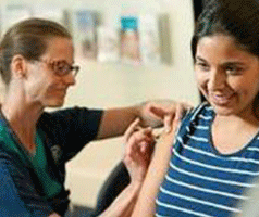 Woman getting a flu vaccine from a nurse