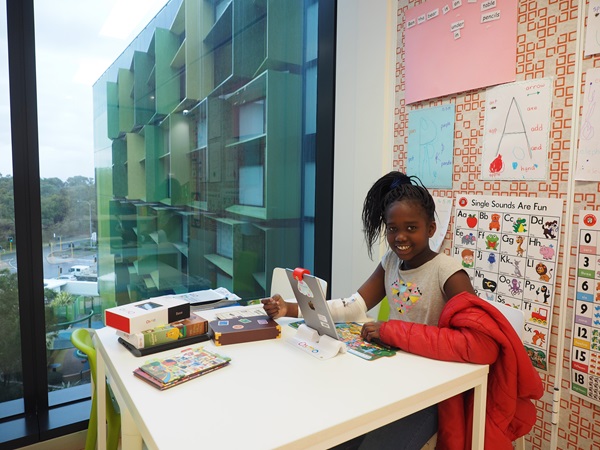 Girl playing at desk at PCH